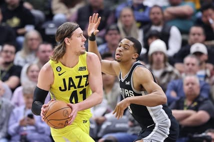 Feb 28, 2023; Salt Lake City, Utah, USA; Utah Jazz forward Kelly Olynyk (41) passes against San Antonio Spurs forward Keldon Johnson (3) in the second quarter at Vivint Arena. Mandatory Credit: Rob Gray-USA TODAY Sports