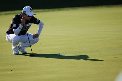 Jun 24, 2022; Bethesda, Maryland, USA; Hyo Joo Kim lines up a putt on the 18th green during the second round of the KPMG Women's PGA Championship golf tournament at Congressional Country Club. Mandatory Credit: Scott Taetsch-USA TODAY Sports