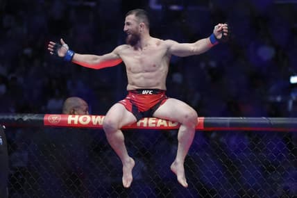 Aug 20, 2022; Salt Lake City, Utah, USA; Merab Dvalishvili (blue gloves) reacts after defeating Jose Aldo (red gloves) during UFC 278 at Vivint Arena. Mandatory Credit: Jeffrey Swinger-USA TODAY Sports