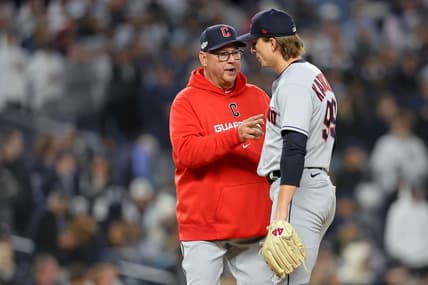 Oct 18, 2022; Bronx, New York, USA; Cleveland Guardians manager Terry Francona (77) takes relief pitcher James Karinchak (99) out of the game against the New York Yankees during the seventh inning in game five of the ALDS for the 2022 MLB Playoffs at Yankee Stadium. Mandatory Credit: Brad Penner-USA TODAY Sports