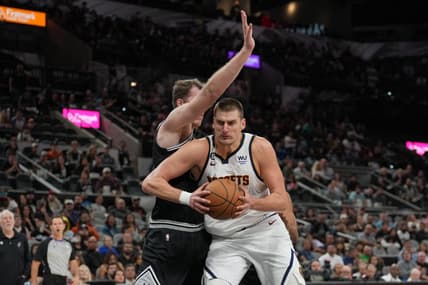 Nov 7, 2022; San Antonio, Texas, USA;  Denver Nuggets center Nikola Jokic (15) drives in against San Antonio Spurs center Jakob Poeltl (25) in the second half at the AT&T Center. Mandatory Credit: Daniel Dunn-USA TODAY Sports