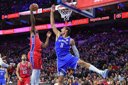 Nov 18, 2022; Philadelphia, Pennsylvania, USA; Philadelphia 76ers center Joel Embiid (21) grabs a rebound against Milwaukee Bucks center Brook Lopez (11) during the third quarter at Wells Fargo Center. Mandatory Credit: Eric Hartline-USA TODAY Sports