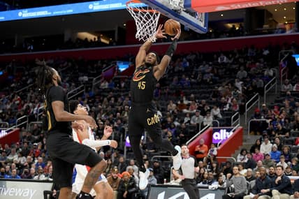 Nov 27, 2022; Detroit, Michigan, USA;  Cleveland Cavaliers guard Donovan Mitchell (45) tries to finish off an alley-oop against the Detroit Pistons in the second quarter at Little Caesars Arena. Mandatory Credit: Lon Horwedel-USA TODAY Sports