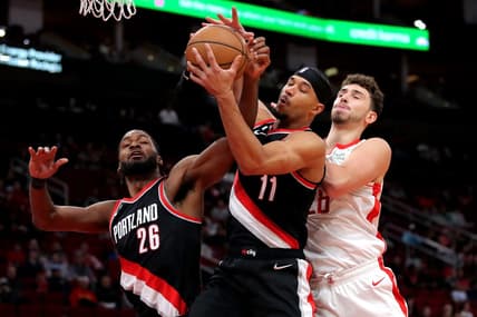 Dec 17, 2022; Houston, Texas, USA; From left, Portland Trail Blazers forward Justise Winslow (26), Portland Trail Blazers guard Josh Hart (11) and Houston Rockets center Alperen Sengun (28) battle for a rebound during the first quarter at Toyota Center. Mandatory Credit: Erik Williams-USA TODAY Sports