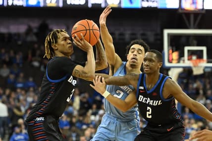 Dec 25, 2022; Omaha, Nebraska, USA;  DePaul Blue Demons guard Jalen Terry (3) scores a three point basket against the Creighton Bluejays in the second half at CHI Health Center Omaha. Mandatory Credit: Steven Branscombe-USA TODAY Sports