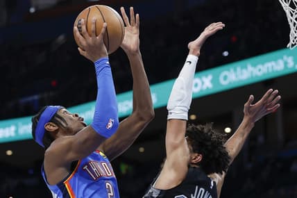 Dec 27, 2022; Oklahoma City, Oklahoma, USA; Oklahoma City Thunder guard Shai Gilgeous-Alexander (2) shoots against San Antonio Spurs guard Tre Jones (33) during the second half at Paycom Center. Oklahoma City won 130-114. Mandatory Credit: Alonzo Adams-USA TODAY Sports