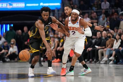 Jan 10, 2023; San Francisco, California, USA; Golden State Warriors forward Andrew Wiggins (22) knocks the ball out of the hands of Phoenix Suns guard Josh Okogie (2) in the fourth quarter at the Chase Center. Mandatory Credit: Cary Edmondson-USA TODAY Sports
