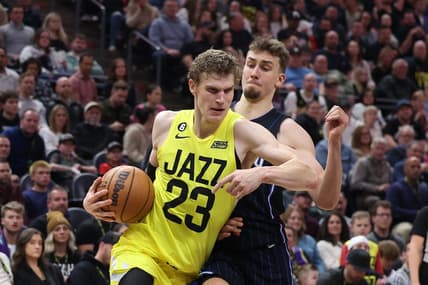 Jan 13, 2023; Salt Lake City, Utah, USA; Utah Jazz forward Lauri Markkanen (23) drives with the ball against Orlando Magic forward Franz Wagner (22) in the second half at Vivint Arena. Mandatory Credit: Rob Gray-USA TODAY Sports