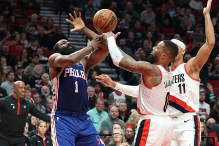 Jan 19, 2023; Portland, Oregon, USA; Philadelphia 76ers guard James Harden (1) looses the ball to Portland Trail Blazers guard Damian Lillard (0) in the second half at Moda Center. Mandatory Credit: Jaime Valdez-USA TODAY Sports