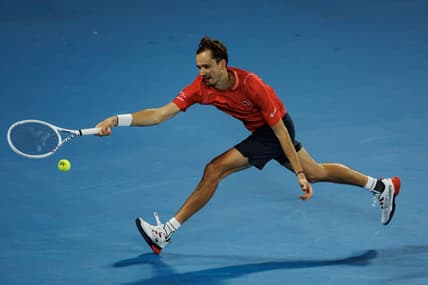 Jan 20, 2023; Melbourne, Victoria, Australia; Daniil Medvedev of Russia hits a shot against Sebastian Korda of the United States on day five of the 2023 Australian Open tennis tournament at Melbourne Park. Mandatory Credit: Mike Frey-USA TODAY Sports
