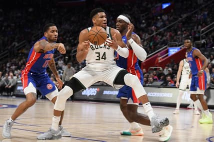 Jan 23, 2023; Detroit, Michigan, USA; Milwaukee Bucks forward Giannis Antetokounmpo's (34) drives to the basket against Detroit Pistons guard Rodney McGruder (17) (left) and center Jalen Duran (0) in the third quarter at Little Caesars Arena. Mandatory Credit: Lon Horwedel-USA TODAY Sports