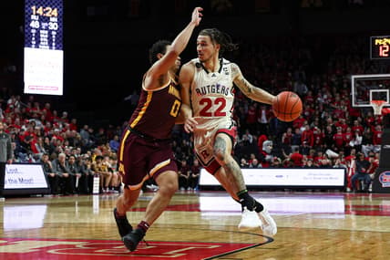 Feb 1, 2023; Piscataway, New Jersey, USA; Rutgers Scarlet Knights guard Caleb McConnell (22) dribbles against Minnesota Golden Gophers guard Taurus Samuels (0) during the second half at Jersey Mike's Arena. Mandatory Credit: Vincent Carchietta-USA TODAY Sports