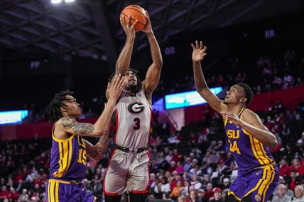 Feb 14, 2023; Athens, Georgia, USA; Georgia Bulldogs guard Kario Oquendo (3) shoots between LSU Tigers forward Tyrell Ward (15) and forward Shawn Phillips (34) during the second half at Stegeman Coliseum. Mandatory Credit: Dale Zanine-USA TODAY Sports