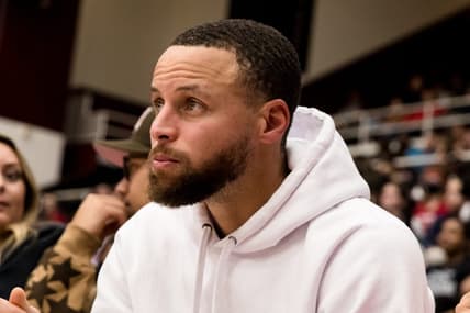 Feb 17, 2023; Stanford, California, USA;  Golden State Warriors guard Stephen Curry watches the game between the Stanford Cardinal and the USC Trojans during the second half at Maples Pavilion. Mandatory Credit: John Hefti-USA TODAY Sports