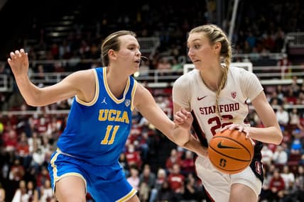 Feb 20, 2023; Stanford, California, USA;  Stanford Cardinal forward Cameron Brink (22) moves past UCLA Bruins forward Emily Bessoir (11) during the first half at Maples Pavilion. Mandatory Credit: John Hefti-USA TODAY Sports