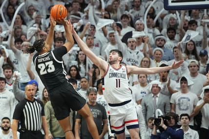 Feb 22, 2023; Storrs, Connecticut, USA; Providence Friars forward Bryce Hopkins (23) shoots the ball against Connecticut Huskies forward Alex Karaban (11) during the second half at Harry A. Gampel Pavilion. Mandatory Credit: Gregory Fisher-USA TODAY Sports