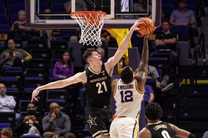 Feb 22, 2023; Baton Rouge, Louisiana, USA; Vanderbilt Commodores forward Liam Robbins (21) blocks the shot of LSU Tigers forward KJ Williams (12) during the second half at Pete Maravich Assembly Center. Mandatory Credit: Stephen Lew-USA TODAY Sports