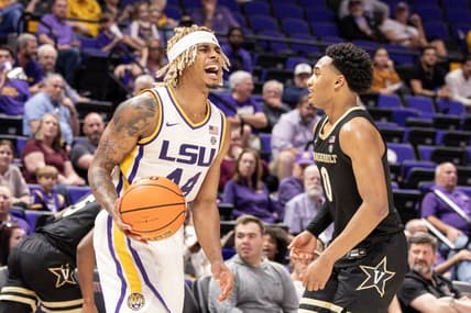 Feb 22, 2023; Baton Rouge, Louisiana, USA; LSU Tigers guard Adam Miller (44) reacts to a play against Vanderbilt Commodores guard Tyrin Lawrence (0) during the second half at Pete Maravich Assembly Center. Mandatory Credit: Stephen Lew-USA TODAY Sports