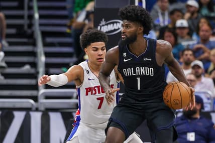 Feb 23, 2023; Orlando, Florida, USA; Detroit Pistons guard Killian Hayes (7) defends Orlando Magic forward Jonathan Isaac (1) during the second half at Amway Center. Mandatory Credit: Mike Watters-USA TODAY Sports
