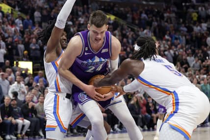 Feb 23, 2023; Salt Lake City, Utah, USA; Utah Jazz center Walker Kessler (24) is fouled by Oklahoma City Thunder guard Luguentz Dort (5) during the second half at Vivint Arena. Mandatory Credit: Chris Nicoll-USA TODAY Sports