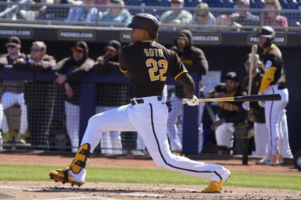 Feb 24, 2023; Peoria, Arizona, USA; San Diego Padres right fielder Juan Soto (22) hits a single against the Seattle Mariners in the first inning at Peoria Sports Complex. Mandatory Credit: Rick Scuteri-USA TODAY Sports