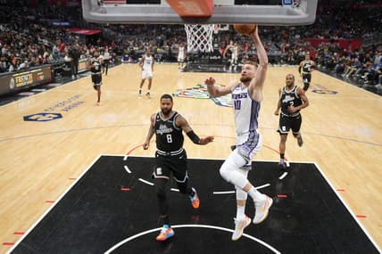 Feb 24, 2023; Los Angeles, California, USA; Sacramento Kings forward Domantas Sabonis (10) shoots the ball against the LA Clippers in the second half at Crypto.com Arena. The Kings defeated the Clippers 176-175 in double overtime. Mandatory Credit: Kirby Lee-USA TODAY Sports