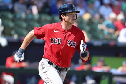 Feb 25, 2023; North Port, Florida, USA; Boston Red Sox first baseman Bobby Dalbec (29) doubles against the Atlanta Braves during the second inning at CoolToday Park. Mandatory Credit: Kim Klement-USA TODAY Sports