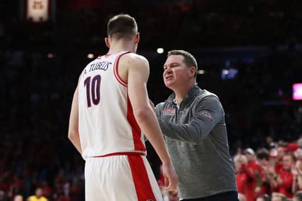 Feb 25, 2023; Tucson, Arizona, USA; Arizona Wildcats forward Azuolas Tubelis (10) and head coach Tommy Lloyd speak on the sidelines against Arizona State Sun Devils in the second half at McKale Center. Mandatory Credit: Zachary BonDurant-USA TODAY Sports