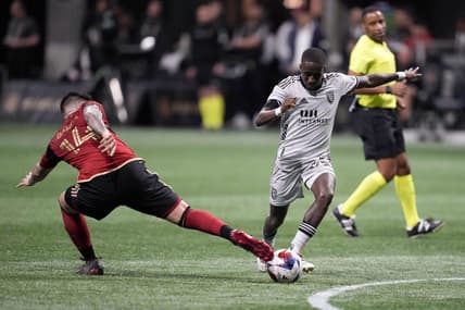 Feb 25, 2023; Atlanta, Georgia, USA; Atlanta United FC midfielder Franco Ibarra (14) defends against San Jose Earthquakes midfielder Jamiro Monteiro (35) in the second half at Mercedes-Benz Stadium. Mandatory Credit: Dale Zanine-USA TODAY Sports