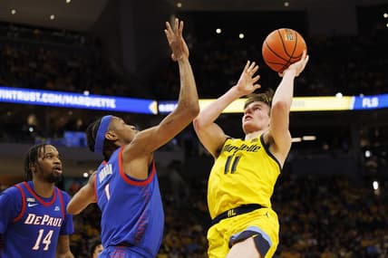 Feb 25, 2023; Milwaukee, Wisconsin, USA;  Marquette Golden Eagles guard Tyler Kolek (11) shoots against DePaul Blue Demons forward Javan Johnson (1) during the second half at Fiserv Forum. Mandatory Credit: Jeff Hanisch-USA TODAY Sports