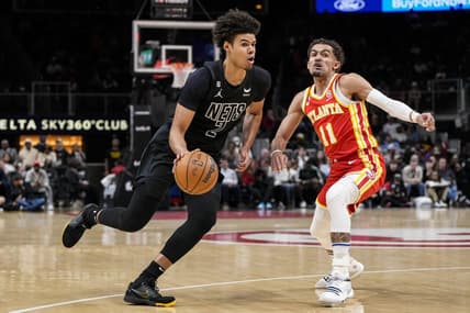 Feb 26, 2023; Atlanta, Georgia, USA; Brooklyn Nets forward Cameron Johnson (2) dribbles past Atlanta Hawks guard Trae Young (11) during the first half at State Farm Arena. Mandatory Credit: Dale Zanine-USA TODAY Sports