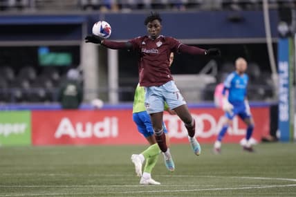 Feb 26, 2023; Seattle, Washington, USA; Colorado Rapids forward Darren Yapi (77) jumps to control the ball in the second half against the Seattle Sounders FC at Lumen Field. Mandatory Credit: Kirby Lee-USA TODAY Sports