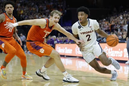 Feb 28, 2023; Charlottesville, Virginia, USA; Virginia Cavaliers guard Reece Beekman (2) drives to the basket as Clemson Tigers forward Hunter Tyson (5) defends in the second half  at John Paul Jones Arena. Mandatory Credit: Geoff Burke-USA TODAY Sports