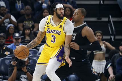 Feb 28, 2023; Memphis, Tennessee, USA; Los Angeles Lakers forward Anthony Davis (3) handles the ball as Memphis Grizzlies forward Xavier Tillman (2) defends during the first half at FedExForum. Mandatory Credit: Petre Thomas-USA TODAY Sports