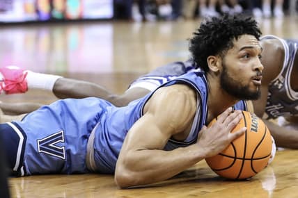 Feb 28, 2023; Newark, New Jersey, USA;  Villanova Wildcats guard Caleb Daniels (14) lays on the floor after recovering a loose ball in the second half against the Seton Hall Pirates at Prudential Center. Mandatory Credit: Wendell Cruz-USA TODAY Sports