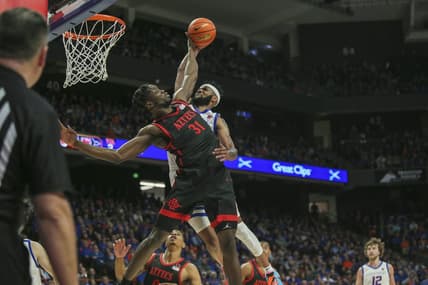 Feb 28, 2023; Boise, Idaho, USA; San Diego State Aztecs forward Nathan Mensah (31) blocks the dunk of Boise State Broncos forward Naje Smith (23) during the second half at ExtraMile Arena. Boise State upsets San Diego State 66-60. Mandatory Credit: Brian Losness-USA TODAY Sports