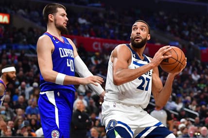 Feb 28, 2023; Los Angeles, California, USA; Minnesota Timberwolves center Rudy Gobert (27) moves to the basket against Los Angeles Clippers center Ivica Zubac (40) during the second half at Crypto.com Arena. Mandatory Credit: Gary A. Vasquez-USA TODAY Sports