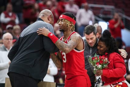 Louisville senior guard El Ellis greets head coach Kenny Payne as his mother gets a hug from athletic director Josh Heird during a pre-game ceremony. The Hokies defeated the Cards 71-54 Tuesday night at the KFC Yum Center. The Cards finished 4-26 overall, 2-17 in the ACC. Feb. 28, 2023

Louisville Vs Virginia Tech Final Home Game 2023
