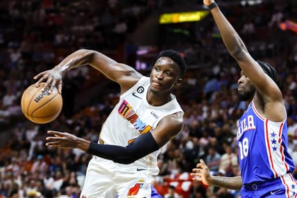 Mar 1, 2023; Miami, Florida, USA; Miami Heat guard Victor Oladipo (4) passes the basketball as Philadelphia 76ers guard Shake Milton (18) defends during the second quarter at Miami-Dade Arena. Mandatory Credit: Sam Navarro-USA TODAY Sports