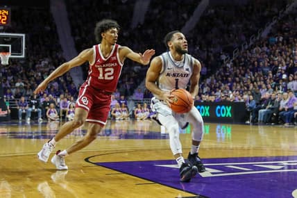 Mar 1, 2023; Manhattan, Kansas, USA; Kansas State Wildcats guard Markquis Nowell (1) drives to the basket against Oklahoma Sooners guard Milos Uzan (12) during the first half at Bramlage Coliseum. Mandatory Credit: Scott Sewell-USA TODAY Sports
