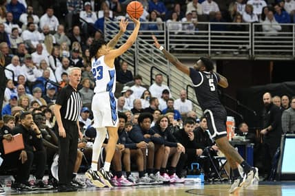 Mar 1, 2023; Omaha, Nebraska, USA;  Creighton Bluejays guard Trey Alexander (23) shoots the ball against Georgetown Hoyas guard Jay Heath (5) in the first half at CHI Health Center Omaha. Mandatory Credit: Steven Branscombe-USA TODAY Sports
