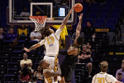 Mar 1, 2023; Baton Rouge, Louisiana, USA;  LSU Tigers forward Jalen Reed (13) blocks a shot against Missouri Tigers guard DeAndre Gholston (4) during the first half at Pete Maravich Assembly Center. Mandatory Credit: Stephen Lew-USA TODAY Sports