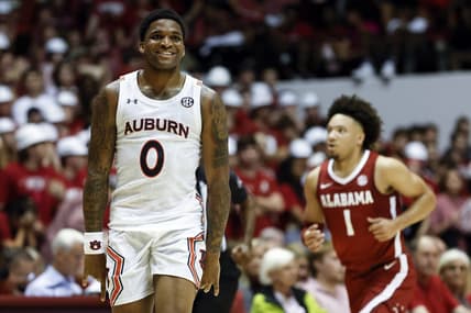 Mar 1, 2023; Tuscaloosa, Alabama, USA; Auburn Tigers guard K.D. Johnson (0) reacts after making a three pointer against the Alabama Crimson Tide during the second half of an NCAA basketball game at Coleman Coliseum. Mandatory Credit: Butch Dill-USA TODAY Sports