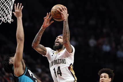 Mar 1, 2023; Portland, Oregon, USA; New Orleans Pelicans small forward Brandon Ingram (14) drives to the basket against Portland Trail Blazers power forward Brendon Watford (2) during the first half at Moda Center. Mandatory Credit: Soobum Im-USA TODAY Sports