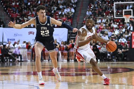 Mar 1, 2023; Las Vegas, Nevada, USA; Utah State Aggies forward Taylor Funk (23) defends against UNLV Rebels guard EJ Harkless (55) in the first half at Thomas & Mack Center. Mandatory Credit: Candice Ward-USA TODAY Sports