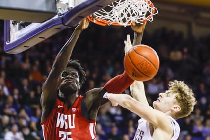 Mar 2, 2023; Seattle, Washington, USA; Washington State Cougars forward Mouhamed Gueye (35) dunks against Washington Huskies guard Cole Bajema (22) during the first half at Alaska Airlines Arena at Hec Edmundson Pavilion. Mandatory Credit: Joe Nicholson-USA TODAY Sports