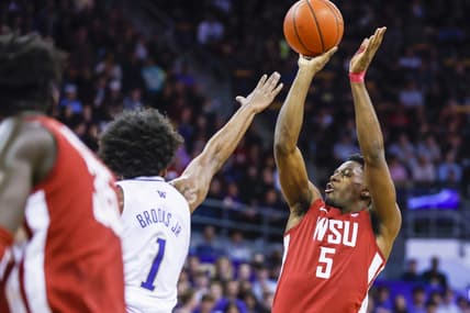 Mar 2, 2023; Seattle, Washington, USA; Washington State Cougars guard TJ Bamba (5) shoots against the Washington Huskies during the first half at Alaska Airlines Arena at Hec Edmundson Pavilion. Mandatory Credit: Joe Nicholson-USA TODAY Sports