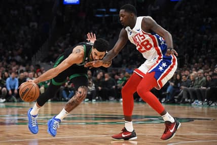 Mar 3, 2023; Boston, Massachusetts, USA;  Brooklyn Nets forward Dorian Finney-Smith (28) defends Boston Celtics forward Jayson Tatum (0) during the first half at TD Garden. Mandatory Credit: Bob DeChiara-USA TODAY Sports