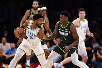 Mar 3, 2023; Los Angeles, California, USA; Los Angeles Lakers guard Malik Beasley (5) handles the ball against Minnesota Timberwolves guard Anthony Edwards (1) during the second quarter at Crypto.com Arena. Mandatory Credit: Jonathan Hui-USA TODAY Sports