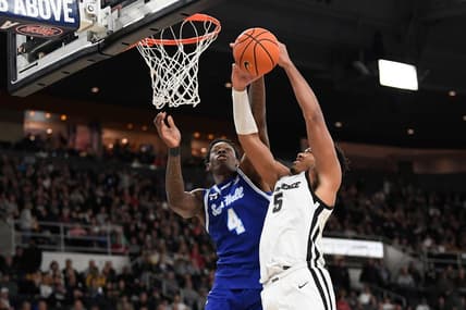 Mar 4, 2023; Providence, Rhode Island, USA; Seton Hall Pirates forward Tyrese Samuel (4) defends the basket from Providence Friars forward Ed Croswell (5) during the first half at Amica Mutual Pavilion. Mandatory Credit: Eric Canha-USA TODAY Sports